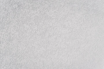 White artistic plaster with a pattern. Background. Repair and painting of walls