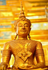 A closeup of a golden Buddha statue in Thailand
