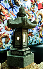 A stone lantern in a Thai Chinese temple
