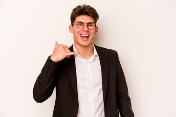 Young caucasian business man isolated on white background showing a mobile phone call gesture with fingers.