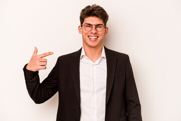 Young caucasian business man isolated on white background person pointing by hand to a shirt copy space, proud and confident