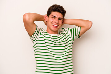 Obraz premium Young caucasian man isolated on white background stretching arms, relaxed position.