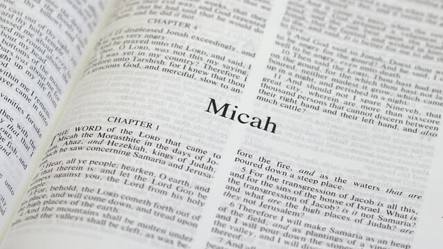 Close Up Shot of  Bible Page Turning to the book of Micah