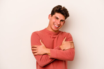 Young caucasian man isolated on white background laughing and having fun.