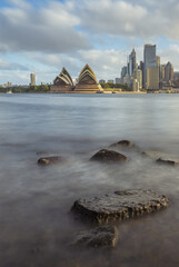 Vertical view of the Sydney Opera House with long exposure ocean in the foreground, Australia