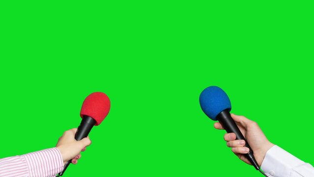 Microphones in the hands of journalists for interview on green screen background. Conference meeting microphones prepared for talker isolated on chroma key background