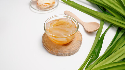 Toddy palm slices Thai dessert syrup in a clear cup on  white background