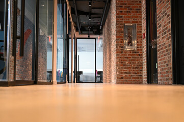 Low angle shot of a hallway interior with brick wall designs