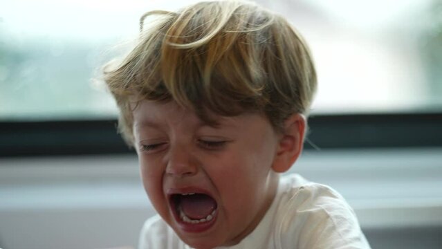 Child tantrum tearful little boy crying