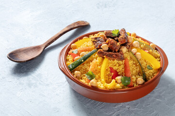 Couscous with meat and vegetables, festive Moroccan dinner, a dish of African cuisine