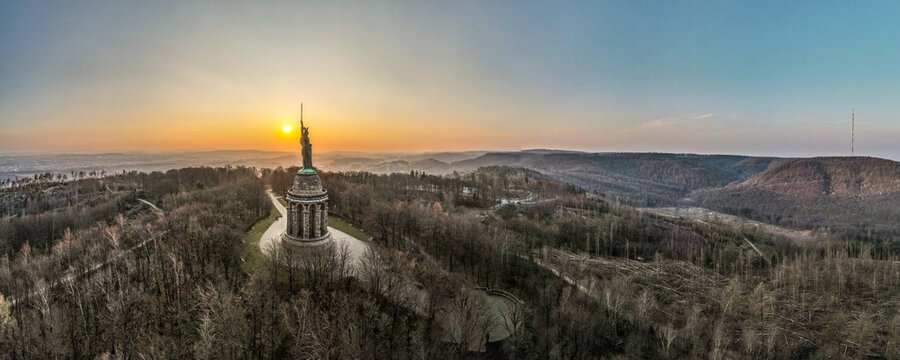 Panoramic view of the Hermannsdenkmal monument on a hill at the sunset in Detmold, Germany