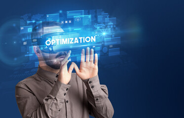 Businessman looking through Virtual Reality glasses