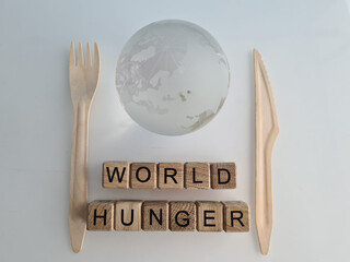 World hunger fork knife and globe closeup