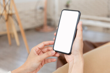 cell phone blank white screen mockup.hand holding texting using mobile on desk at office.background empty space for advertise.work people contact marketing business,technology
