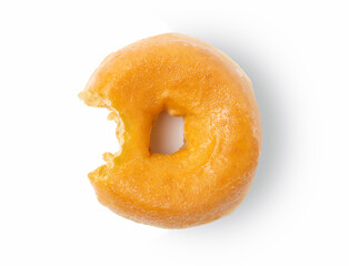 One bite missing of plain donut on white background.
