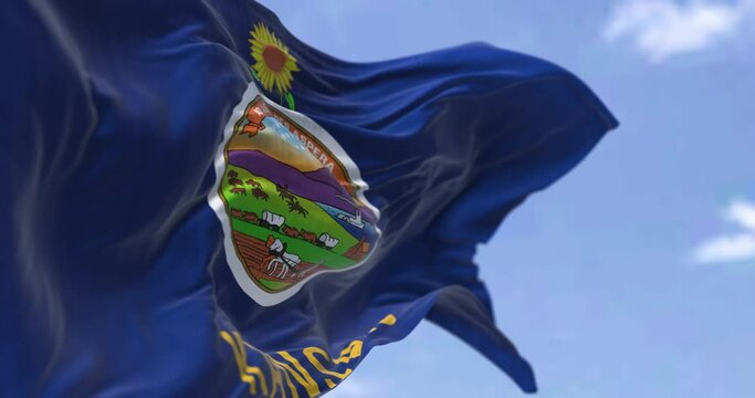 The US state flag of Kansas waving in the wind. Kansas is a state in the Midwestern United States. Democracy and independence. Seamless looping in slow motion