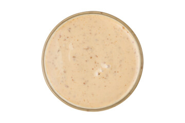 Cup of nut sauce on a  white background. Top view.