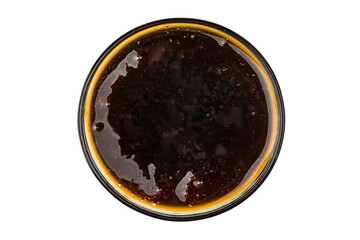 A cup with barbecue sauce on a white background. Top view.