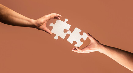 Holding puzzle. Closeup hand of connecting jigsaw puzzle. Business solutions, success and strategy...