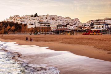View of the old town of Albufeira from the beach after sunset, Portugal