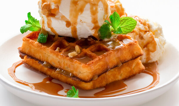 dessert. waffles with caramel syrup, ice cream and fresh mint close-up