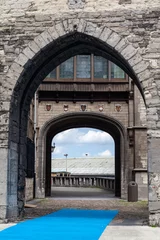 Fotobehang Arched stone entrance of the Het Steen medieval fortress in Antwerp, Belgium © Alexandre Fagundes/Wirestock Creators