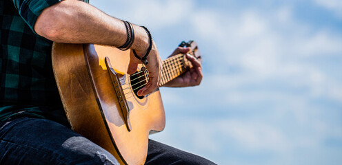 Acoustic guitars playing. Music concept. Guitars acoustic. Male musician playing guitar, music...