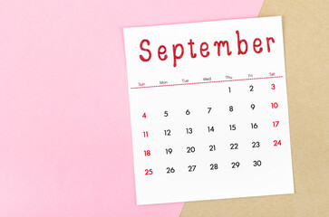 Fototapeta na wymiar September 2022 calendar on pink background with empty space.
