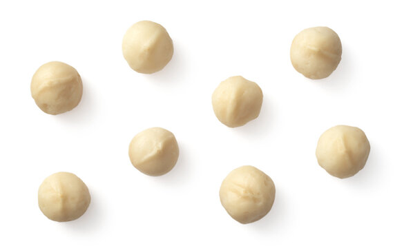 Unshelled Macadamia Nuts Isolated On White Background, Top View.