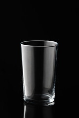 Glass of water or whiskey and wine. Empty glass for alcoholic beverages on black background.