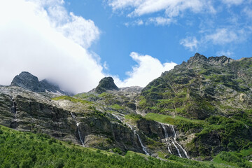 beautiful summer landscape with Sofia waterfalls, mountains, green natural background. trip, journey, hiking, adventure concept. Caucasus mountains, Karachay-Cherkess Republic. Arkhyz