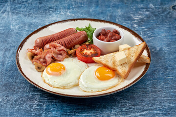 traditional breakfast with egg and sausages