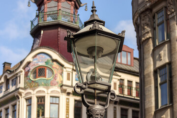 Fototapeta na wymiar Leipzig, Saxony, Germany 03-18-2022 historic street lamp in front of the Art Nouveau building 