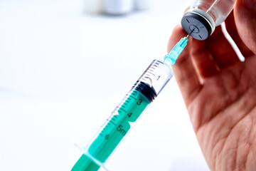  Vaccine in vial with syringe