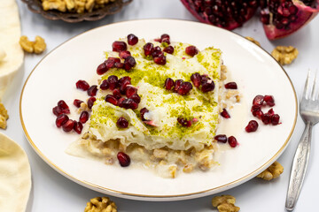 Gullac dessert ( milk dessert ) on a white background. Traditional Turkish dessert. close up