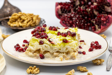 Gullac dessert ( milk dessert ) on a white background. Traditional Turkish dessert. close up