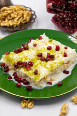 Gullac dessert ( milk dessert ) on a white background. Traditional Turkish dessert. close up