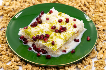Gullac dessert. Traditional Turkish dessert sprinkled with walnuts. Gullac is a dessert made with milk. close up