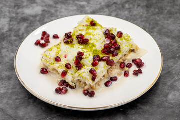 Gullac dessert ( milk dessert ) on a dark background. Traditional Turkish dessert. close up