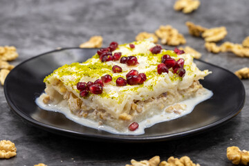 Gullac dessert ( milk dessert ) on a dark background. Traditional Turkish dessert. close up