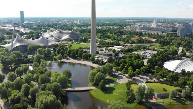 Aerial shot flying backwards revealing the Olympic Tower in Munich, Germany