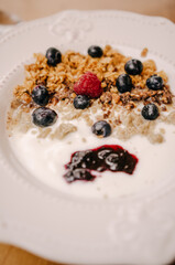 Appetizing porridge or cereal with berries. Delicious breakfast, healthy food concept.