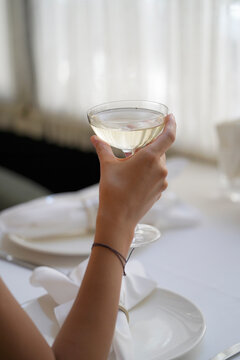 Woman Hand Holding Glass With Martini Cocktail, Close-up