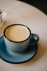 Hot and delicious latte on a white table