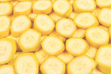 Fresh banana slices background. Top view.