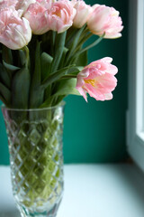 Pink tulips on dark green background. Copy space. Greeting card. Valentines day