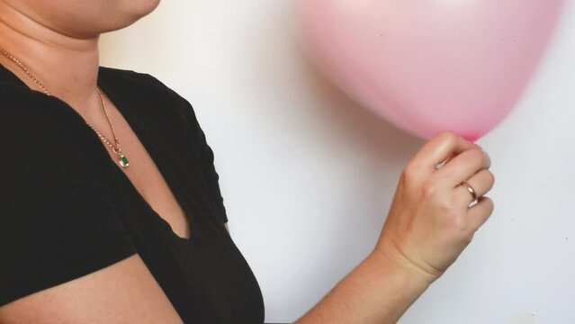 Girl playing with pink balloon ,preparation for the party  concept, 4k footage 