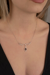 women's gold pendant around the neck of a girl, women's jewelry, pendant with stones, women's accessories, women's jewelry