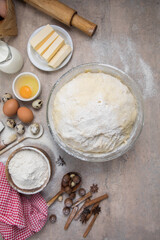 Beat flour and kitchen utensils, a baking dish, a rolling pin with eggs on the table. Baking, cooking concept. Chef making bread and gingerbread cookies. The cook kneads and rolls the dough.