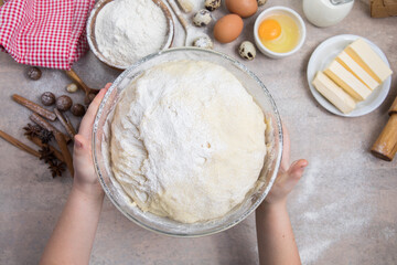 Beat flour and kitchen utensils, a baking dish, a rolling pin with eggs on the table. Baking, cooking concept. Chef making bread and gingerbread cookies. The cook kneads and rolls the dough.
